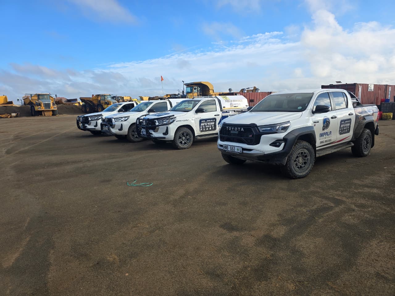 RGN Plant-branded support vehicles parked at a work site
